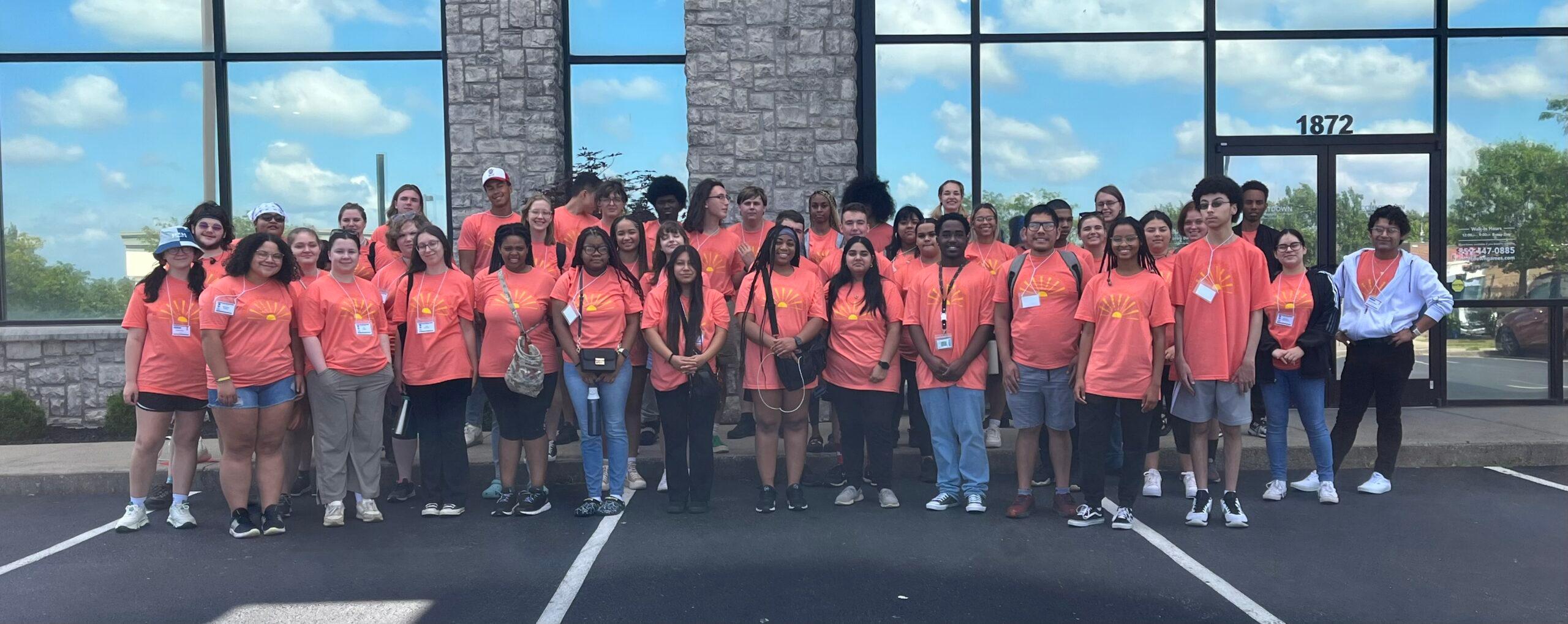 Group photo from ESSP Kickoff wearing orange shirts.